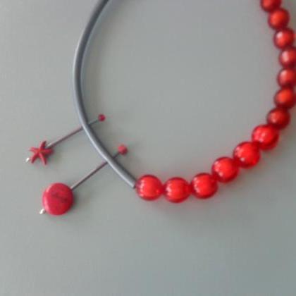 Red Rubber Asymmetric Tube Statement Necklace..