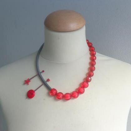 Red Rubber Asymmetric Tube Statement Necklace..