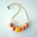 Orange Necklace With Gold Cord