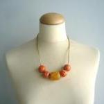 Orange Necklace With Gold Cord